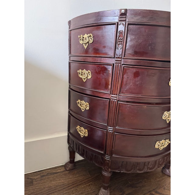 This bow-front (demilune) chest of drawers is executed in a classic Georgian or Regency–inspired style, likely crafted...