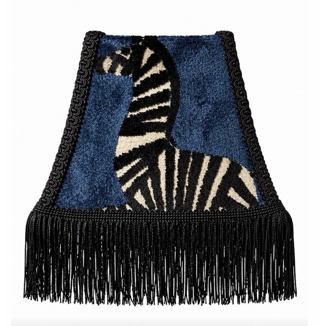 A striking designer lamp shade crafted in Regal Farlow “Sapphire Zebra” velvet, featuring a bold zebra motif in black and...