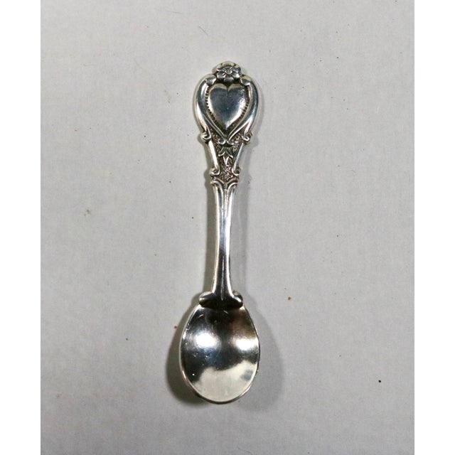 Lovely set of 4 Fostoria open salt cellars made for Avon from the 1960's. 4 late 19th century heart motive sterling spoons...