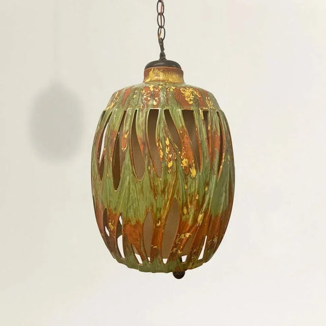 A groovy mid-20th century American terracotta lantern with the best green and yellow splatter glaze, a cylindrical raw...