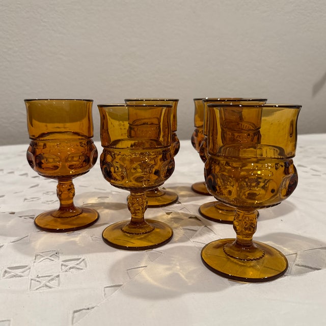6 used in excellent condition. Vintage Indiana Thumprint Amber Goblets.