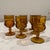 6 used in excellent condition. Vintage Indiana Thumprint Amber Goblets.