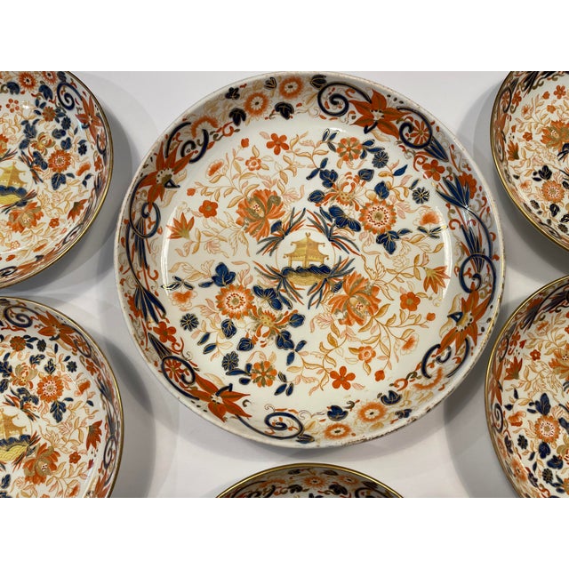 Set of six Wedgwood bowls in the Pagoda pattern with orange, blue and gilt Imari flavored decoration centering an Asian...