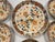 Set of six Wedgwood bowls in the Pagoda pattern with orange, blue and gilt Imari flavored decoration centering an Asian...