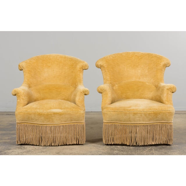A refined pair of 19th-century French Napoleon III crapaud armchairs, sourced in Provence, France. Handcrafted with solid...