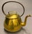 18th century French brass teapot, circa 1790, featuring a classic form and sturdy construction characteristic of the...