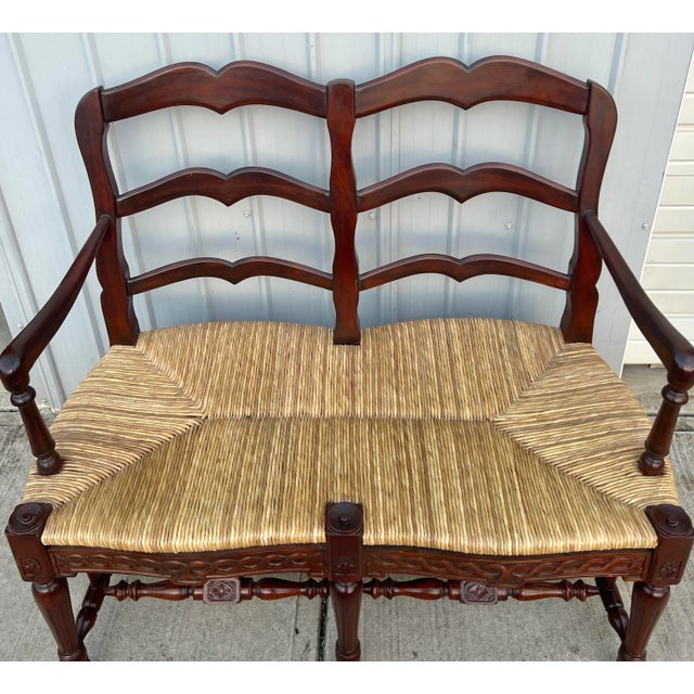 Hard to find carved country French Ladderback settee bench. Beautifully shaped back with a natural rush seat. The front...