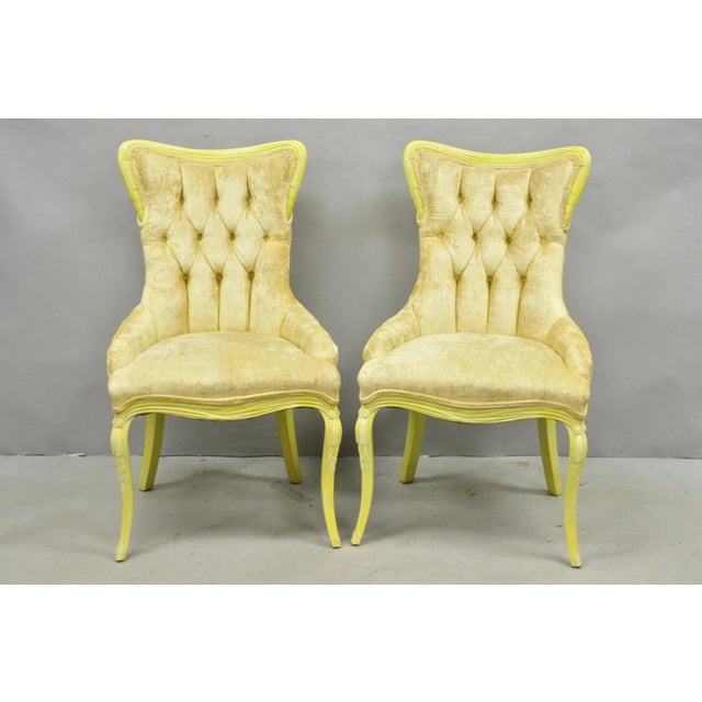 Vintage French Hollywood Regency Yellow Tufted Side Chairs with Drape Carved Frames - a Pair. Circa Mid 20th Century....