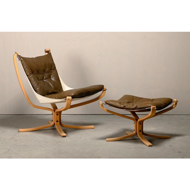 Falcon Lounge Chair and Ottoman, designed by Sigurd Ressell for Vatne Møbler, Norway, 1970s. Curved beech frame, connected...
