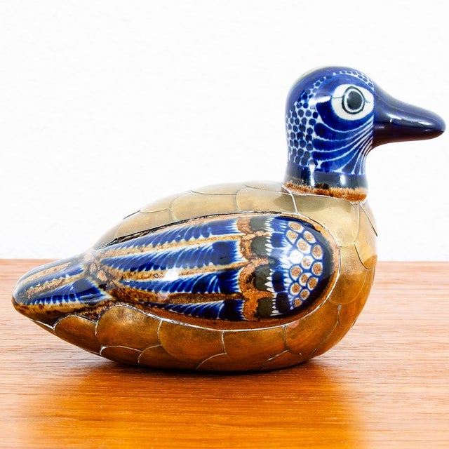 Blue and Gold ceramic duck sculpture with intricate designs. Excellent Piece of decor to display. Well made and shows...