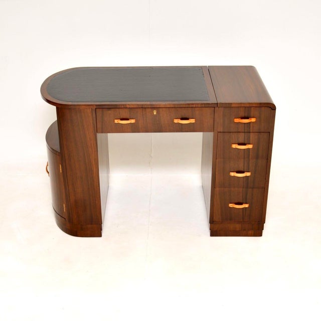A stunning original Art Deco figured walnut leather top desk. This was made in England, it dates from the 1930’s. It has...