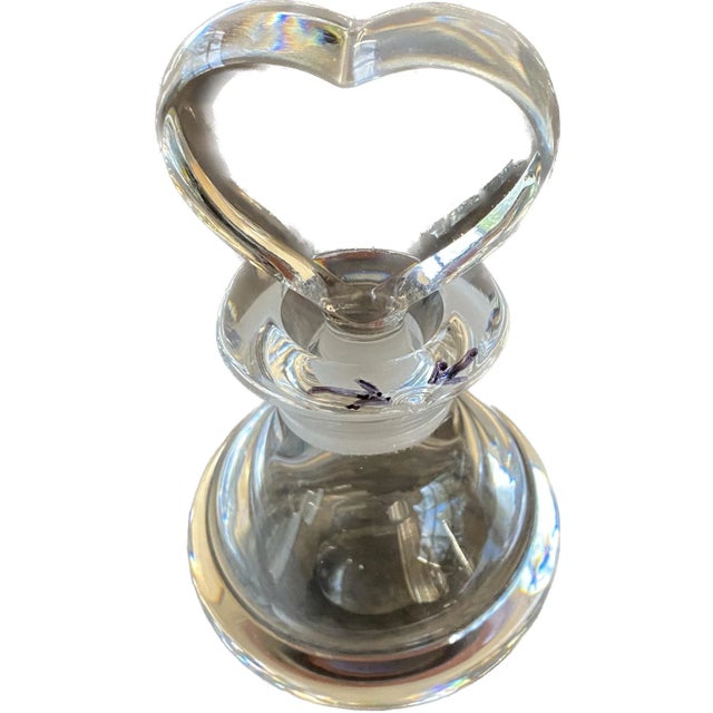 This stunning Orrefors Sweden crystal perfume bottle features a beautiful heart-shaped stopper, adding an extra touch of...
