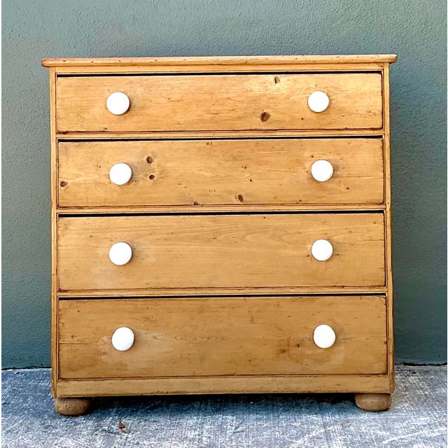 This exquisite English Country chest of drawers is a masterwork of primitive functionalism, perfectly blending rustic...