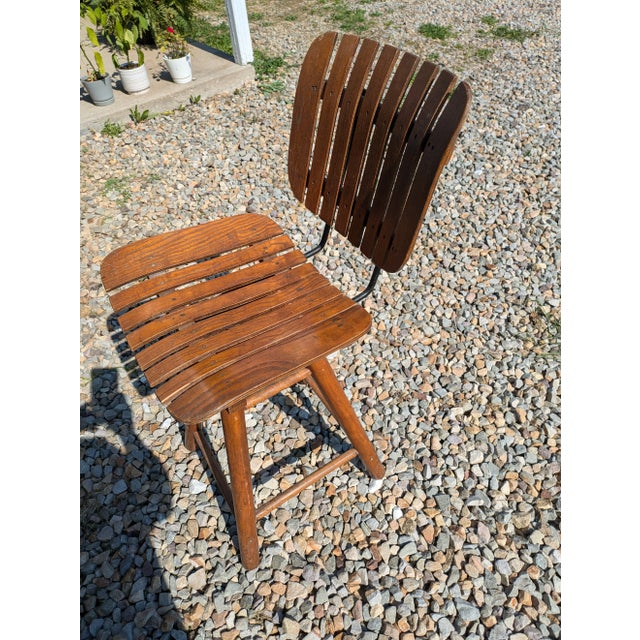 Slat light wooden barstool is in good condition. It would look good at a bar top or as a counter stool. Sturdy and in good...