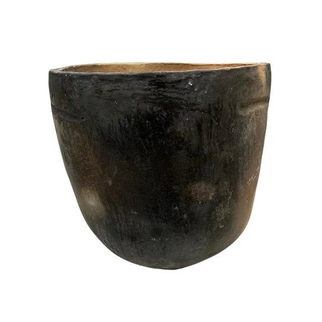 This Gafsa clay vessel hails from Tunisia, specifically the town of Gafsa known for its pottery craftsmanship. This...