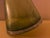 A striking vintage art glass vase in a rich olive/avocado green, featuring an unusual asymmetrical conical silhouette and...