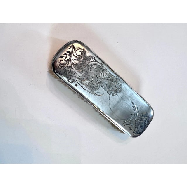 A beautiful Etched Silver Clothing Brush with natural Bristles. The brush would be a compliment to any mens or women's...