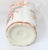 A decorative pair of Japanese Meiji style porcelain vases with tall cylindrical bodies and flared rims The white grounds...