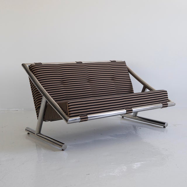 c. 1970s, fully restored in Maharam “Toostripe” - there is wear to the frame including scuffs, scratches, minor losses to...