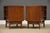 A pair of mid century modern walnut two drawer nightstands with sculpted pulls and dovetail drawers made by Young...
