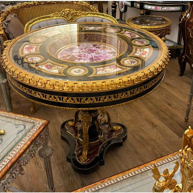 Make a spectacular statement in your dining room with this grand French-inspired dining table, featuring a dramatic black...