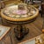 Make a spectacular statement in your dining room with this grand French-inspired dining table, featuring a dramatic black...