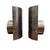 This striking pair of vintage Brutalist wall sconces features sculptural curved steel shades with a beautifully mottled...