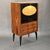 Incredible bar cabinet with an elegant Italian design from the 1950s. Rosewood veneer structure, black lacquered drop-down...