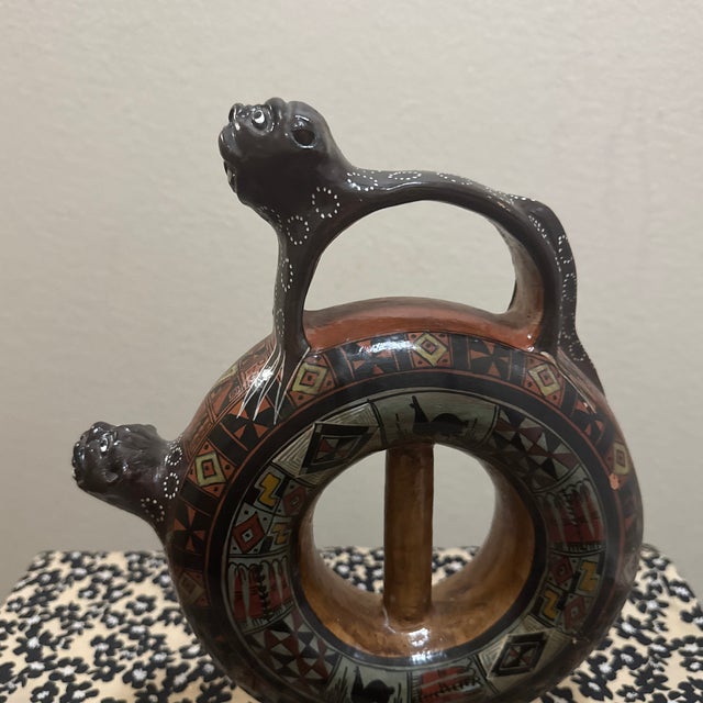 Capture the mystique of the Andes with this stunning vintage Cusco-style pottery vessel. Masterfully handcrafted in Peru,...