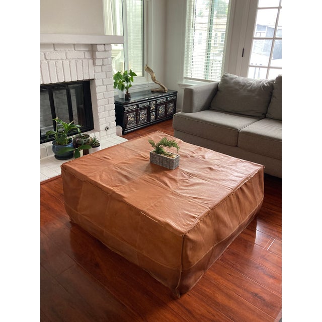 Ottoman or can be used as a coffee table. 40 x 40 x 18. The photos do not display the Morrocan Ottoman completely stuffed....