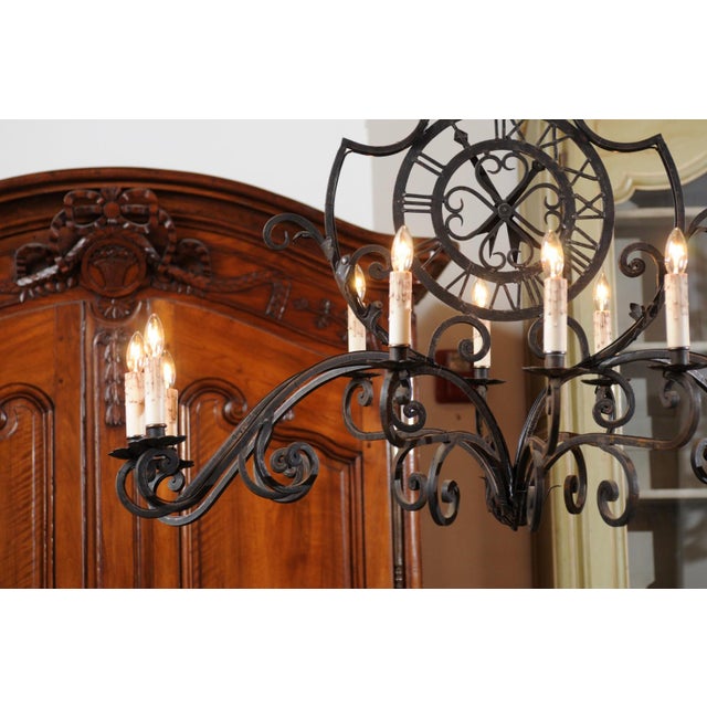 Early 20th Century French 12-Light Wrought-Iron Chandelier with Clock Motif and Scrolling Armature For Sale - Image 10 of 12