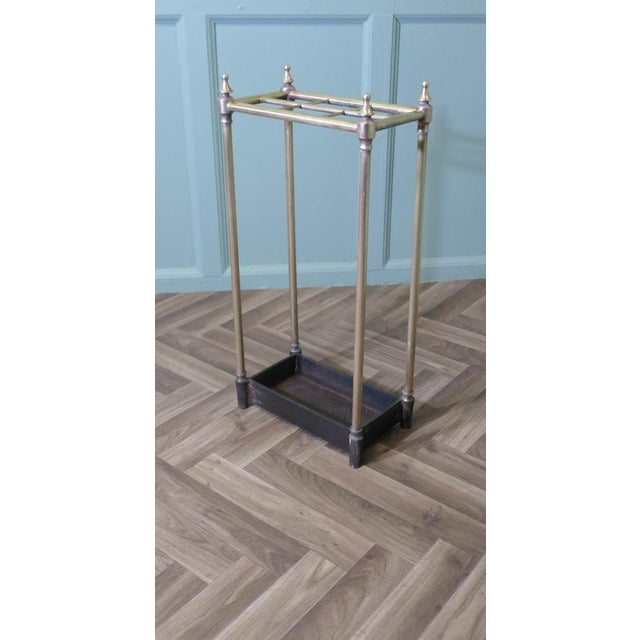 Brass and Cast Iron Walking Stick Stand or Umbrella Stand A charming piece, the stand has a brass top divided into 6...