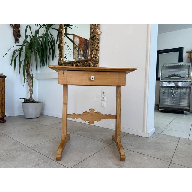 Charming rustic sewing table from the Gründerzeit period. Dimensions: Height 82 x 63 x 41 cm. Charming rustic table from...