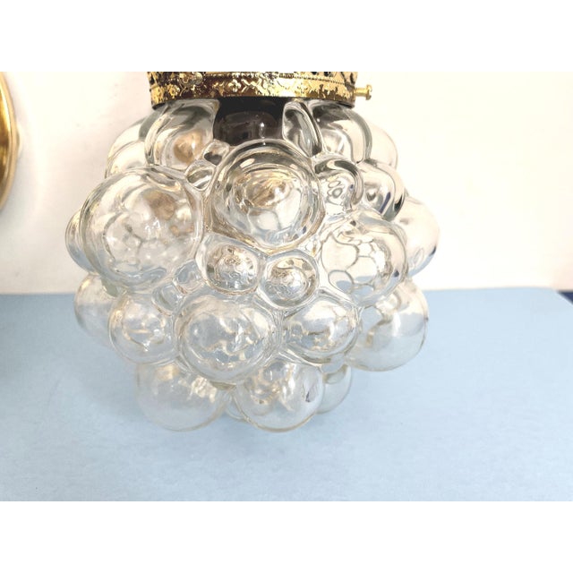 Gorgeous pair of mid century clear glass bubble sconces in the style of Helena Tynell capped by gold filigreed metal crown...
