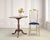 A charming 19th century English Georgian dessert, side, or occasional table constructed with a tripod base and a tilt-top...