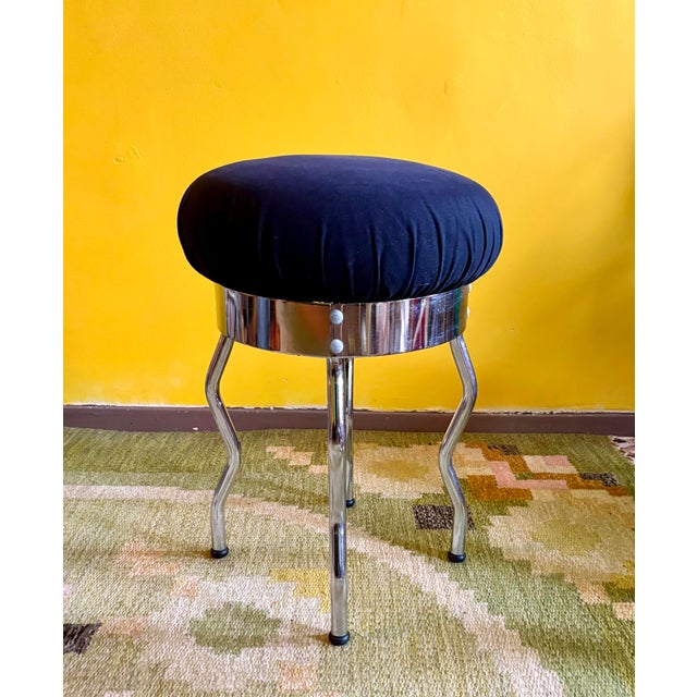 Stool, model Uri, designed by Per Idar Ledang in 1995 for Ikea. It features a cushion upholstered in blue velvet and...