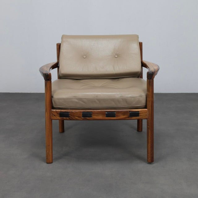A refined mid-century modern lounge chair designed by sven ellekaer and produced by coja culemborg in the netherlands...