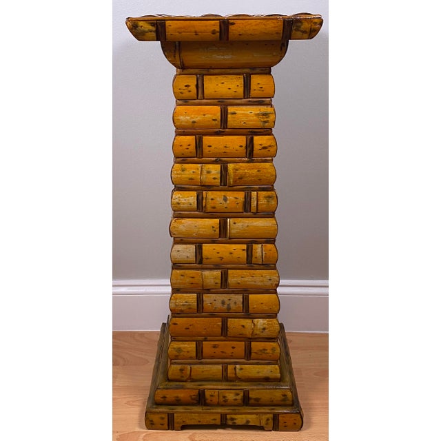 A striking vintage bamboo pedestal side table featuring a highly sculptural, architectural form composed of stacked and...