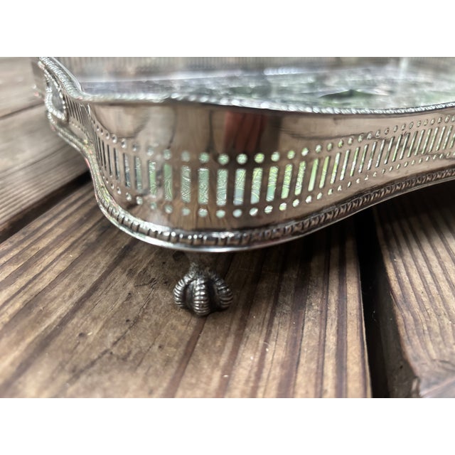 A Sheffield Silver plate Gallery Tray of classic Georgian design, the undulating reticulated gallery with open handles at...