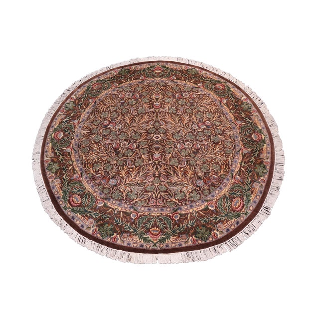 This hand‑knotted Pak Persian round rug showcases the finest expression of traditional Persian artistry. Each piece is...