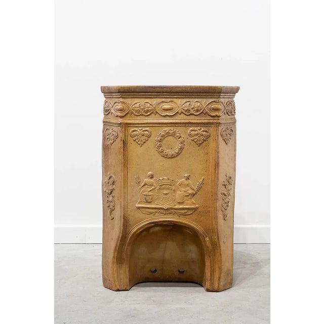 Large rectangular pot with rounded corners made of terracotta and sand-coloured enamel. Decoration in relief of palmettes...