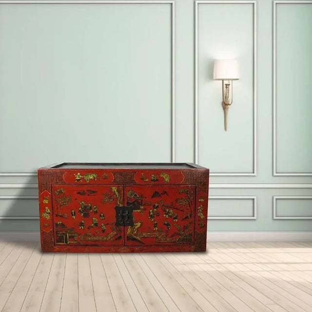 This red Asia cabinet has 2 panels door adorn with hand painted garden sceneries. The lines, patina, faded painting, and...