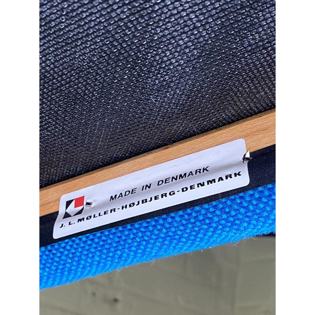 The chair is upholstered in its original, vibrant blue Hallingdal wool fabric (Kvadrat, designed by Nanna Ditzel in 1965),...