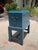 Authentic Somerset Bay painted storage box on stand in a deep blue finish. The piece features a hinged lid, warm wood...