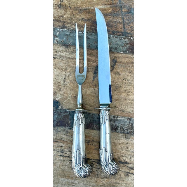 Exude refined elegance at your next formal dinner with this exquisite two-piece carving set. Featuring ornate handles...