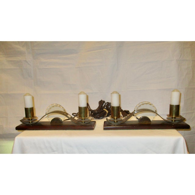 Low Sleek art deco profile with double candlestick shades in milk glass. Lifts off bayonet sockets. Cut brass construction...