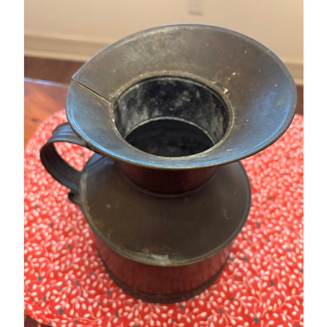 Very early primitive tin milk pitcher. Good condition. Wonderful decor for your home.