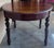 An antique Spanish Carved Walnut Four Legs dining table. Circa 1900. Having a round top over a beaded skirt, rising on a...