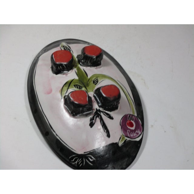 Pop-Art Posey footed oval pottery bowl. It is hand painted in colors of black, cream celery green, purple and red. A funky...