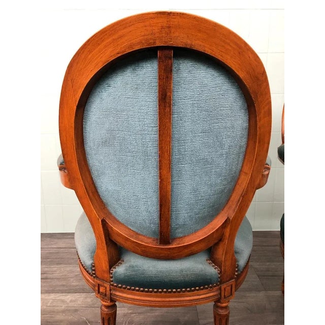 Louis XVI -style pair of armchairs 1920s Fago wood structure with inlaid medallions on the front The legs are tapered and...